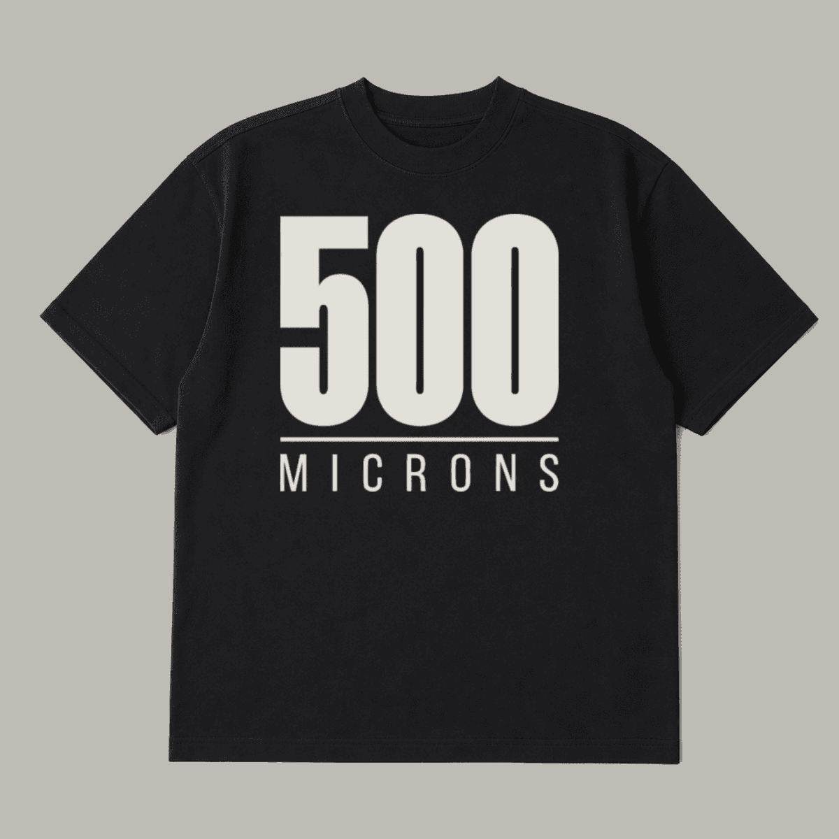500 MICRONS printed on a black heavyweight tee