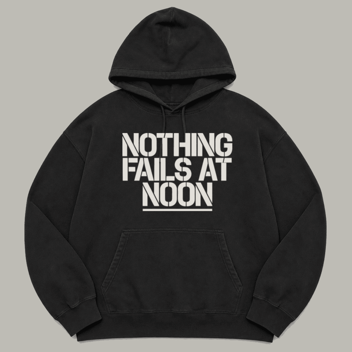 NOTHING FAILS AT NOON printed on a black garment-dyed hoodie